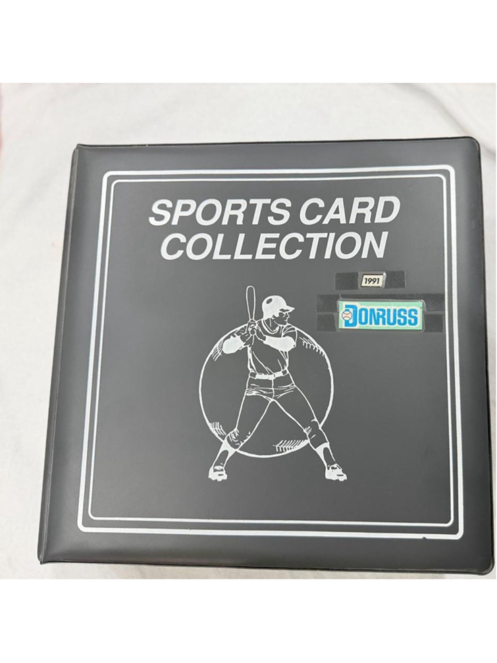1991 Donruss baseball card collection with white outline of a baseball player in